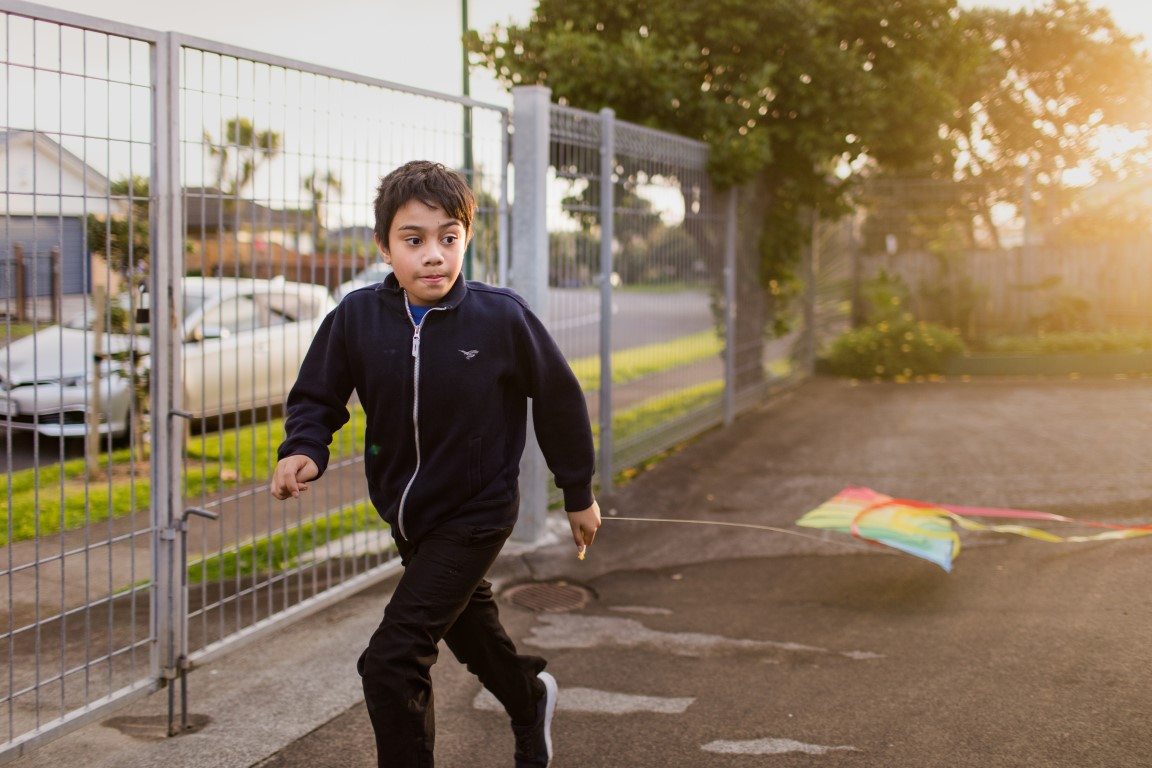 Boy playing with kite