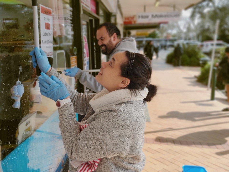 Adrienne putting up posters